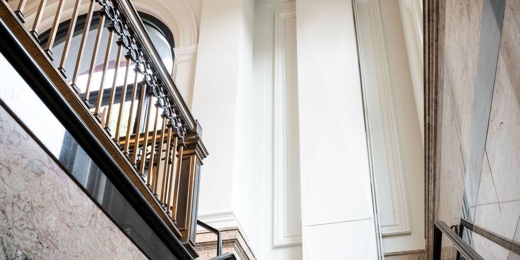 Marble stair landing in a converted bank building