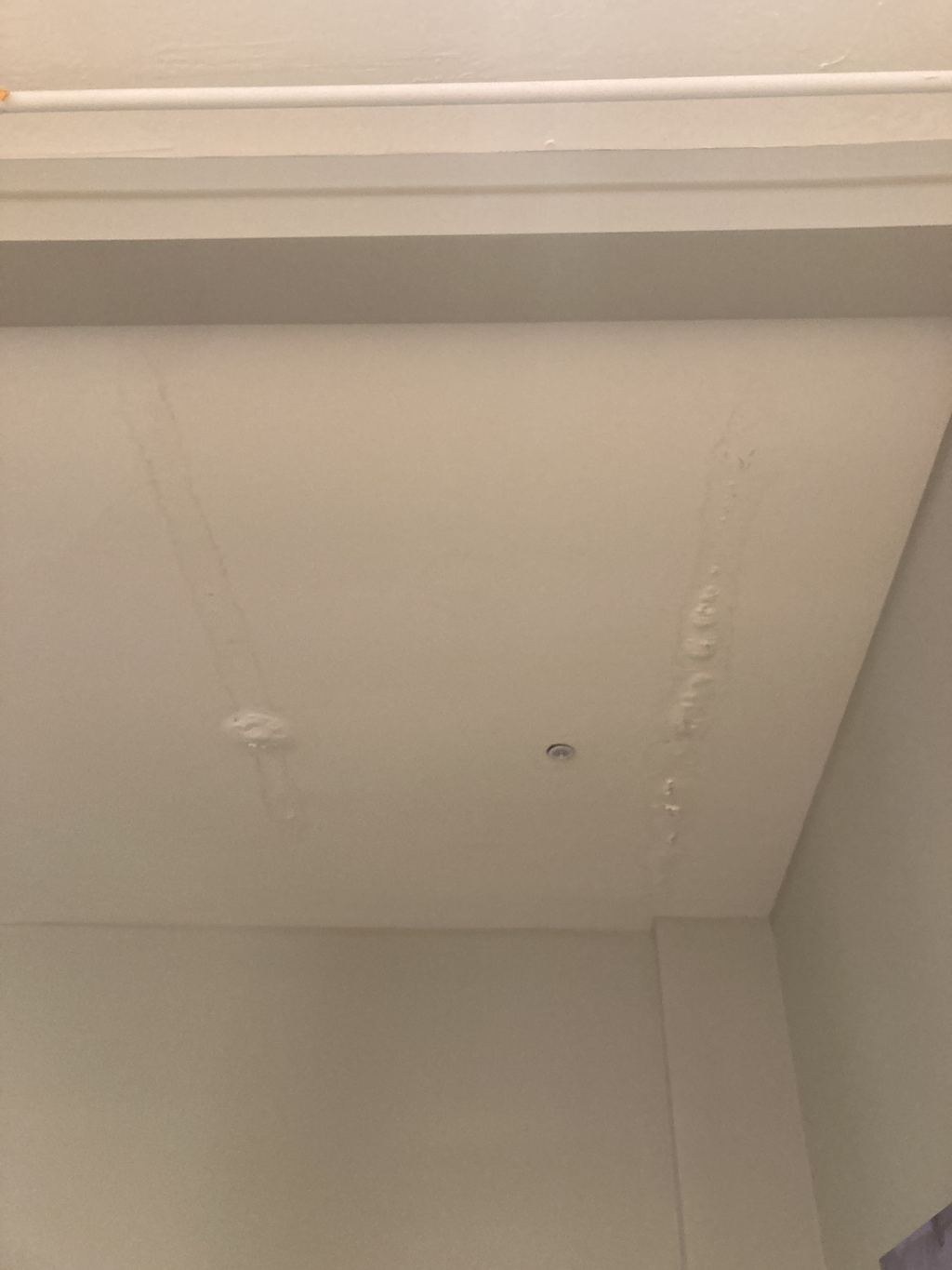 Commercial restroom: water-damaged ceiling