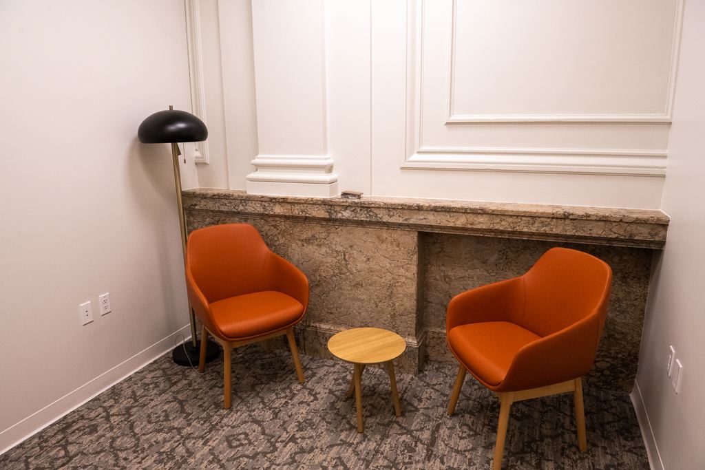 Lounge with the original stone wainscot and new seating