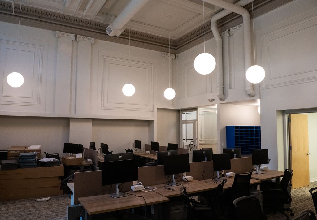 Original plaster panel walls with new pendant lighting