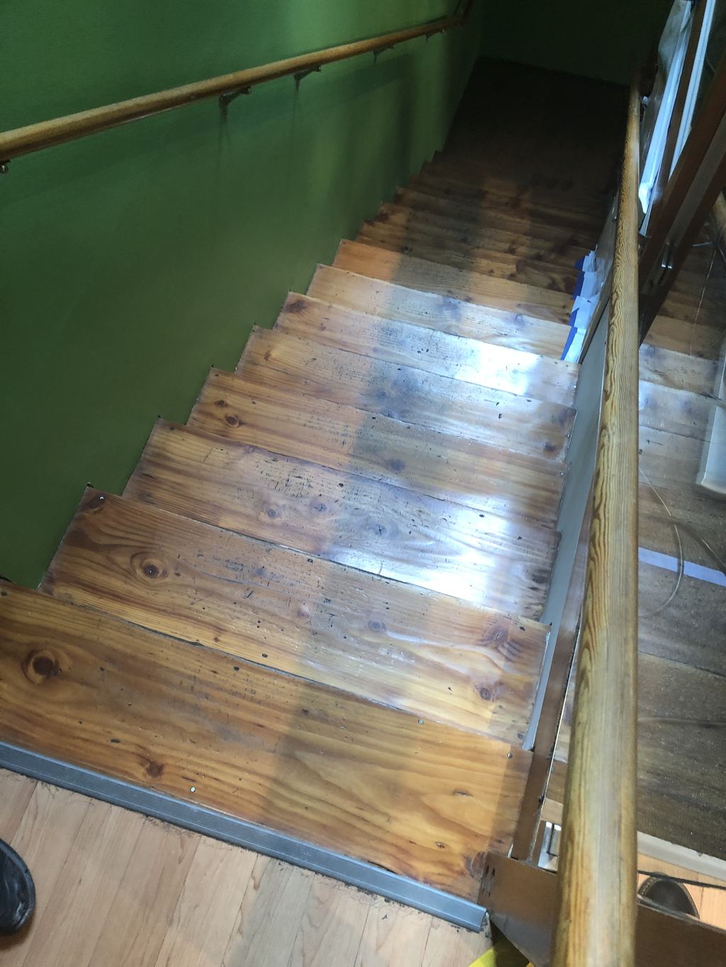 Original wood stair refinished after water damage, San Francisco